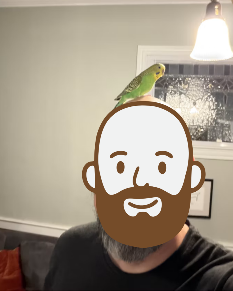 Brumby, a budgie, perched on their owner's head